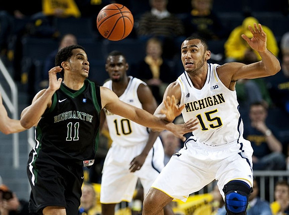 Tim Hardaway Jr. (10) and Jon Horford (15)