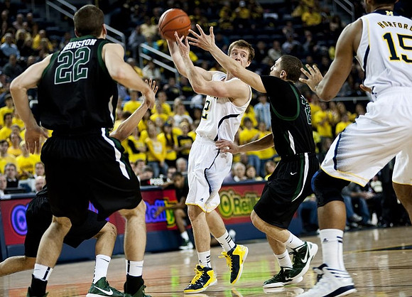 Spike Albrecht (2) and Jon Horford (15)