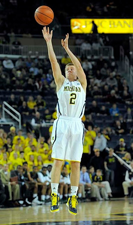 Jordan Morgan (52), Trey Burke (3), Tim Hardaway Jr. (10), and Glenn Robinson III (1)