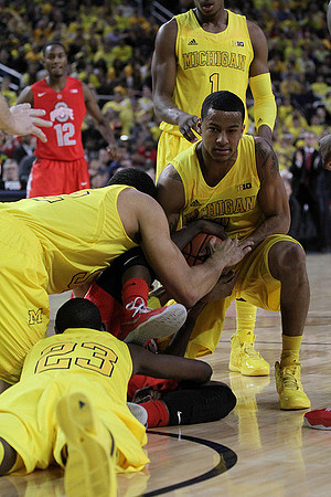 Caris LeVert (23), Jordan Morgan (52), Trey Burke (3), and Glenn Robinson III (1)