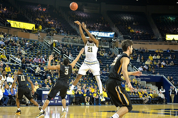 Derrick Walton Jr. (10) and Zak Irvin (21)