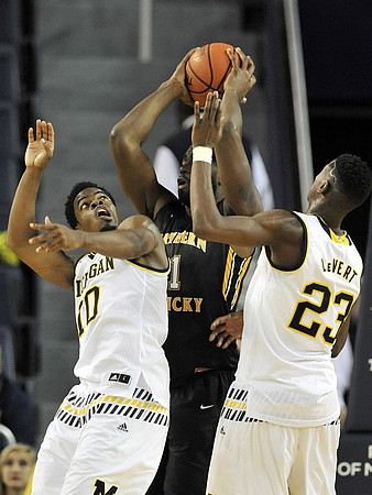 Derrick Walton Jr. (10) and Caris LeVert (23)
