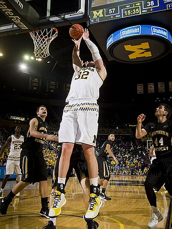 Caris LeVert (23) and Ricky Doyle (32)