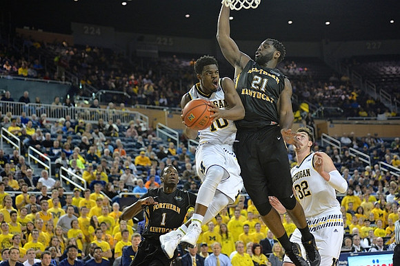Derrick Walton Jr. (10) and Ricky Doyle (32)