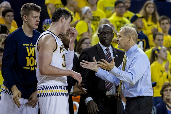 Moritz Wagner (13), Ricky Doyle (32), Bacari Alexander, and John Beilein