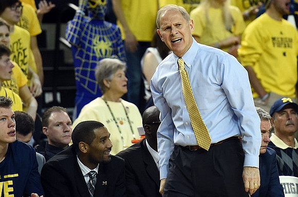 Moritz Wagner (13), LaVall Jordan, and John Beilein