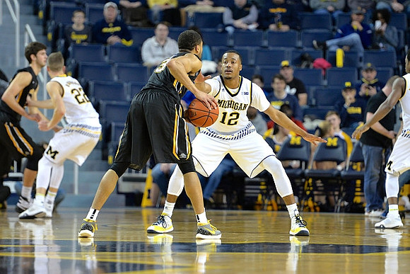 Duncan Robinson (22) and Muhammad-Ali Abdur-Rahkman (12)