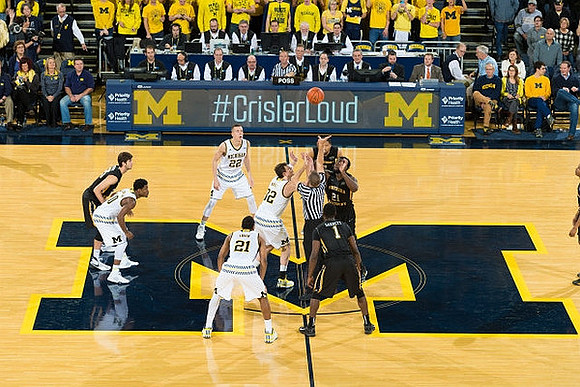 Derrick Walton Jr. (10), Duncan Robinson (22), Zak Irvin (21), and Ricky Doyle (32)
