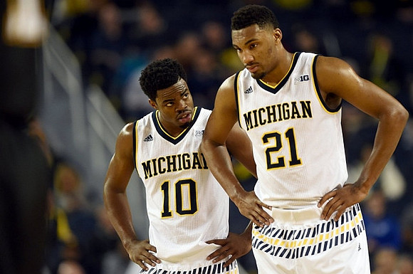 Derrick Walton Jr. (10) and Zak Irvin (21)