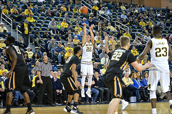Duncan Robinson (22) and Caris LeVert (23)