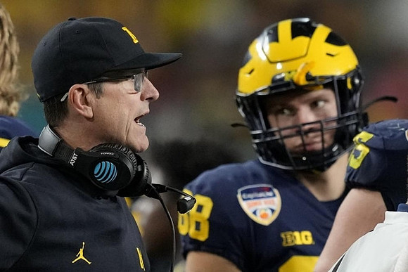 Jim Harbaugh and Matthew Hibner (88)