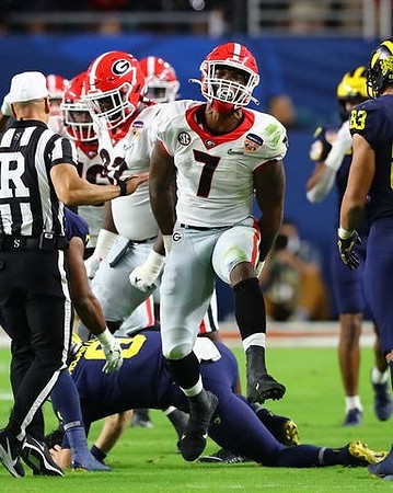 J.J. McCarthy (9) and Erick All (83)