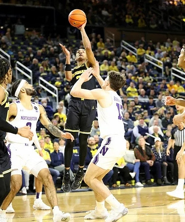 Kobe Bufkin (2) and Dug McDaniel (0)