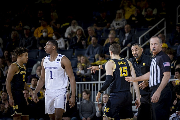 Terrance Williams II (5), Joey Baker (15), and Juwan Howard