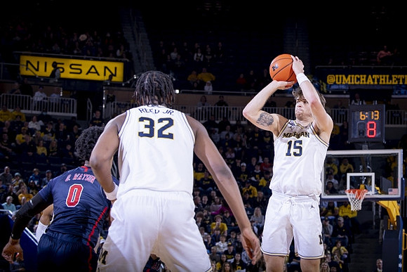 Tarris Reed Jr. (32) and Joey Baker (15)