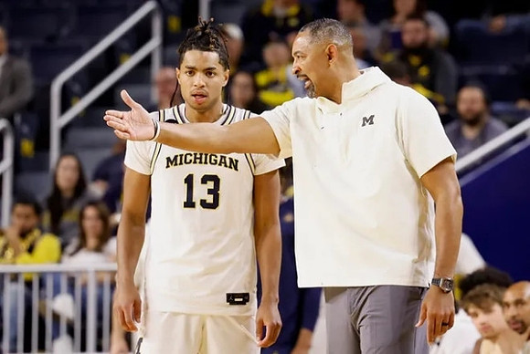 Jett Howard (13) and Juwan Howard