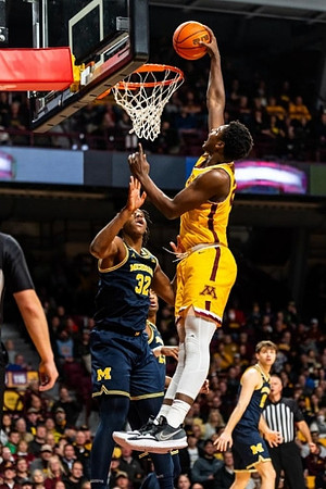 Tarris Reed Jr. (32) and Joey Baker (15)