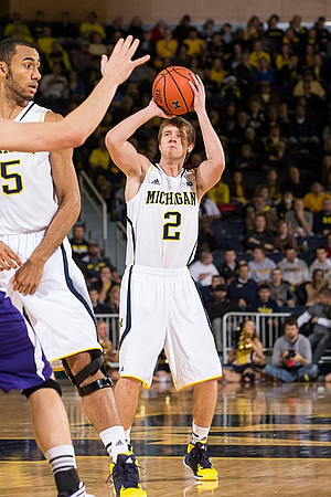 Jon Horford (15) and Spike Albrecht (2)