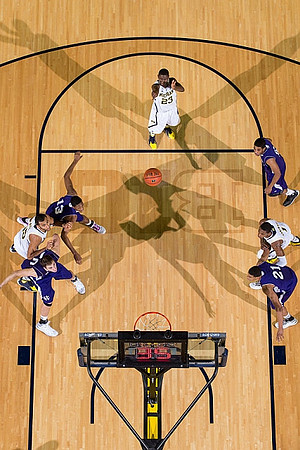 Jon Horford (15), Caris LeVert (23), and Glenn Robinson III (1)
