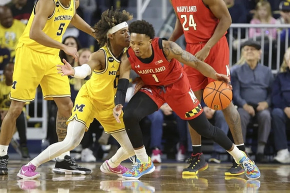 Terrance Williams II (5) and Dug McDaniel (0)
