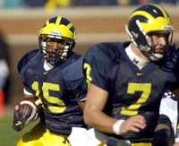 Steve Breaston (15) and Chad Henne (7)
