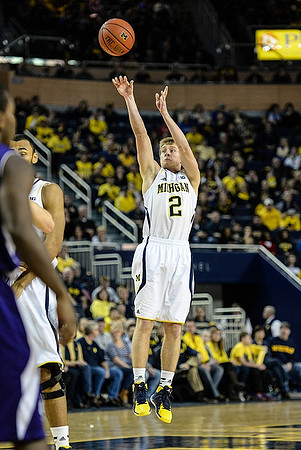 Jon Horford (15) and Spike Albrecht (2)