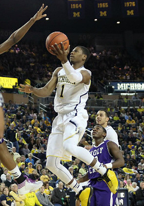 Glenn Robinson III (1) and Jordan Morgan (52)