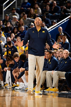 Juwan Howard, Howard Eisley, and Phil Martelli