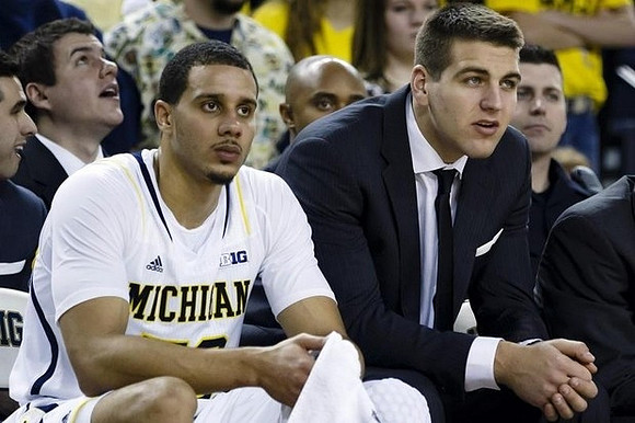 Jordan Morgan (52) and Mitch McGary (4)