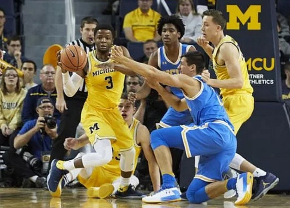 Zavier Simpson (3), Moritz Wagner (13), and Duncan Robinson (22)