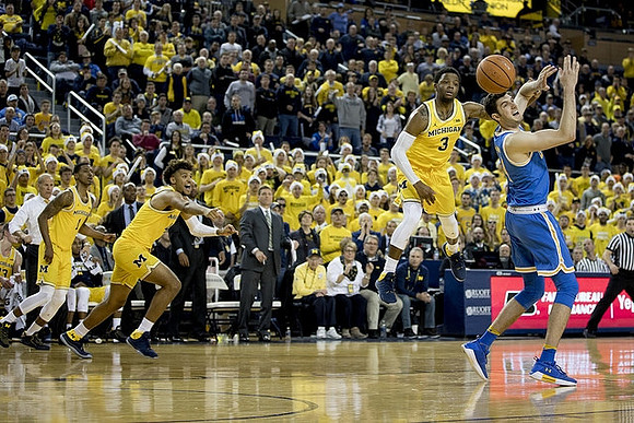 Charles Matthews (1), Isaiah Livers (4), and Zavier Simpson (3)