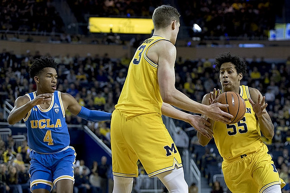 Moritz Wagner (13) and Eli Brooks (55)