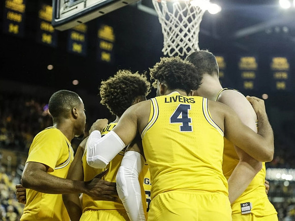 Muhammad-Ali Abdur-Rahkman (12), Jordan Poole (2), Isaiah Livers (4), and Moritz Wagner (13)