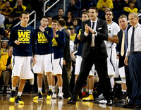 Andrew Dakich (5), Sean Lonergan (20), Brad Anlauf (14), Mark Donnal (34), Mitch McGary (4), Jordan Morgan (52), Jeff Meyer, and John Beilein