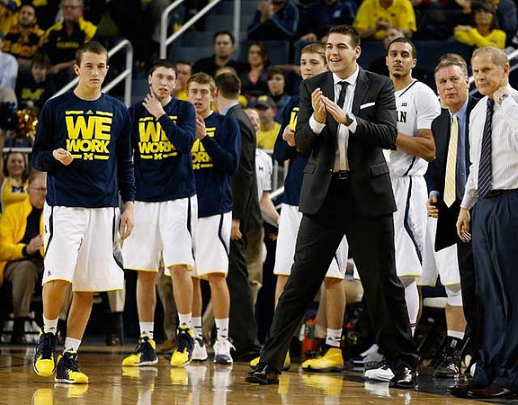 Andrew Dakich (5), Sean Lonergan (20), Brad Anlauf (14), Mark Donnal (34), Mitch McGary (4), Jordan Morgan (52), Jeff Meyer, and John Beilein