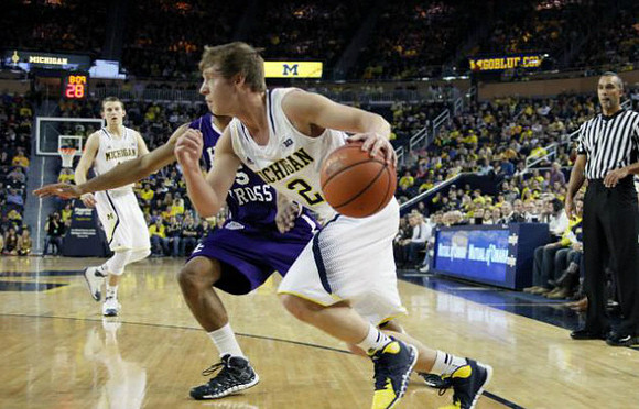Nik Stauskas (11) and Spike Albrecht (2)