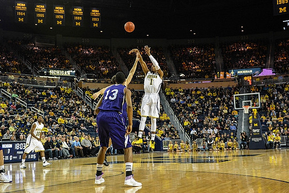 Derrick Walton Jr. (10) and Glenn Robinson III (1)