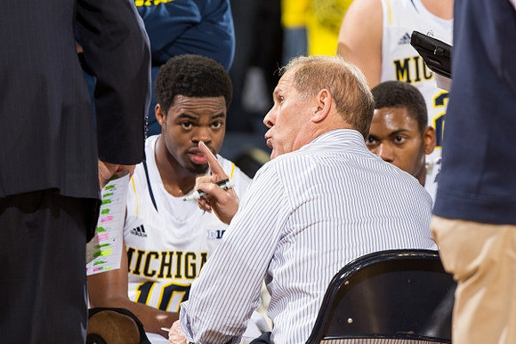 Derrick Walton Jr. (10), Glenn Robinson III (1), and John Beilein