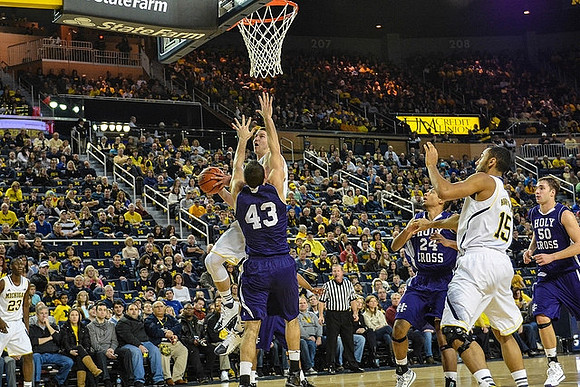 Caris LeVert (23), Nik Stauskas (11), and Jon Horford (15)