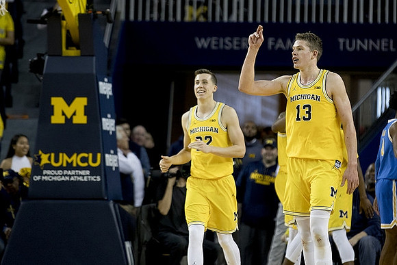 Duncan Robinson (22) and Moritz Wagner (13)