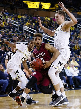 Muhammad-Ali Abdur-Rahkman (12) and Mark Donnal (34)