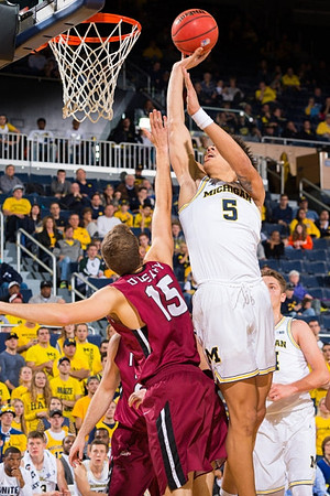 D.J. Wilson (5) and Mark Donnal (34)