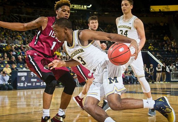 Xavier Simpson (3) and Mark Donnal (34)