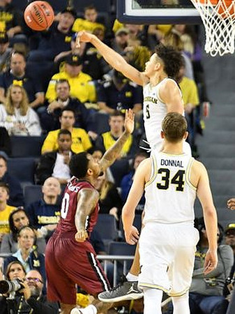 D.J. Wilson (5) and Mark Donnal (34)