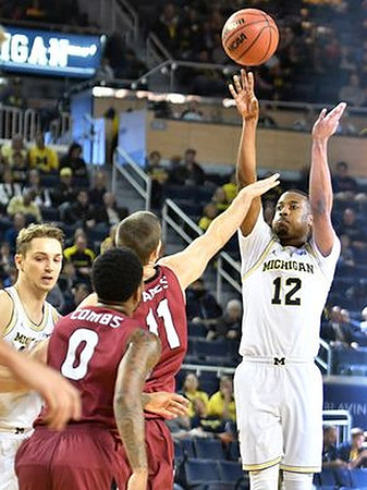 Mark Donnal (34) and Muhammad-Ali Abdur-Rahkman (12)
