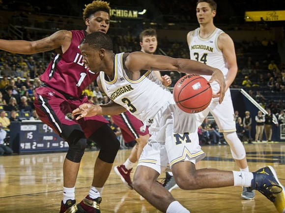 Xavier Simpson (3) and Mark Donnal (34)