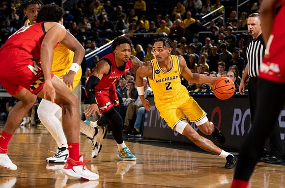 Tarris Reed Jr. (32) and Kobe Bufkin (2)