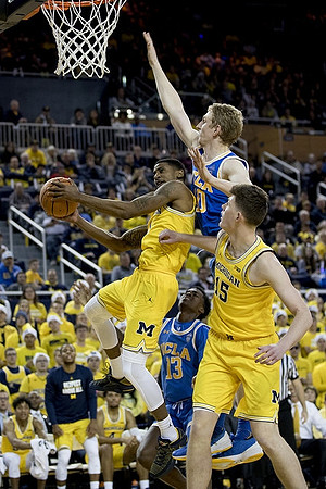 Charles Matthews (1) and Jon Teske (15)