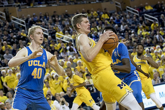 Moritz Wagner (13), Zavier Simpson (3), and Muhammad-Ali Abdur-Rahkman (12)