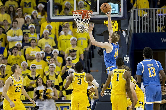 Duncan Robinson (22), Zavier Simpson (3), Charles Matthews (1), and Moritz Wagner (13)